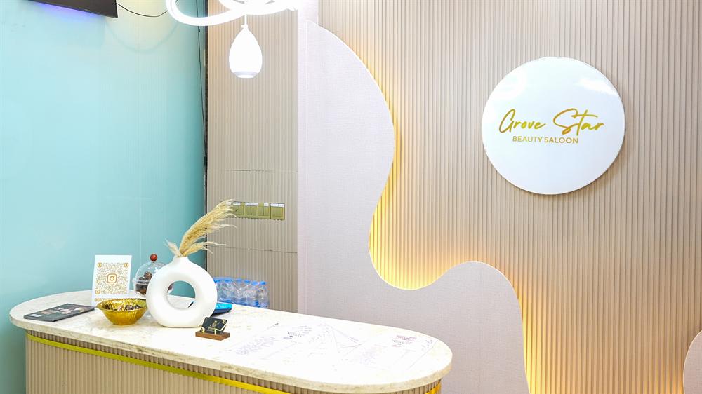 Grove Star Beauty Salon reception with signature logo wall
