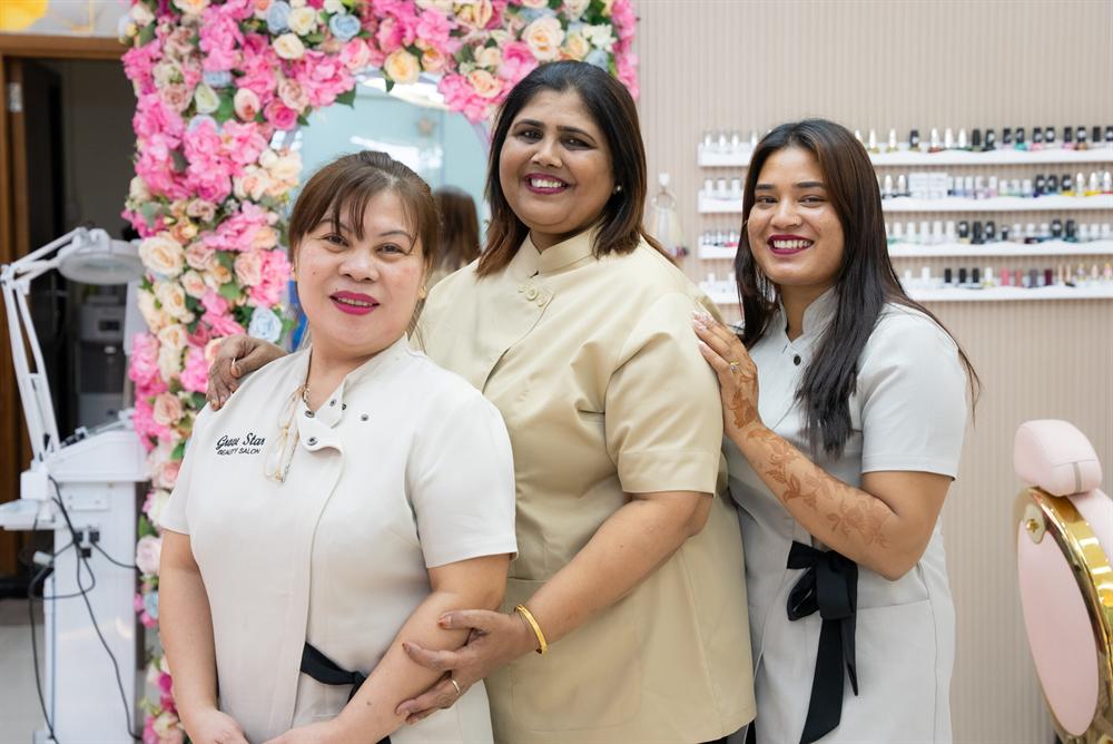 Smiling Grove Star team members in the nail studio
